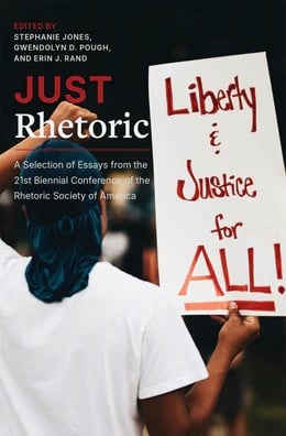 A picture of a person carrying a sign that says Liberty and Justice for all.
